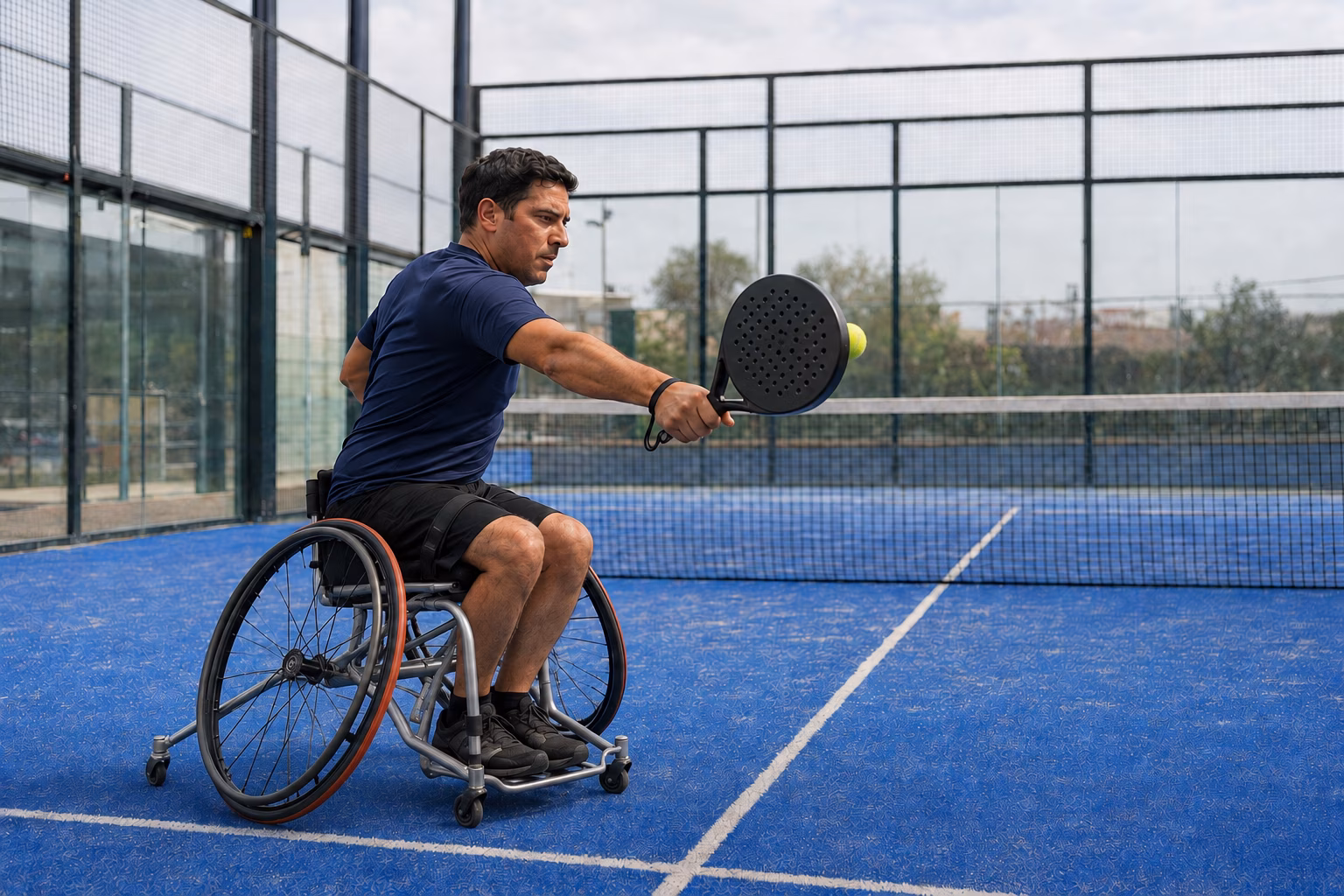wheelchair padel player on an accessible padel court